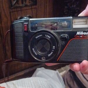 Nikon Black Film Photography Camera with Integrated Flash